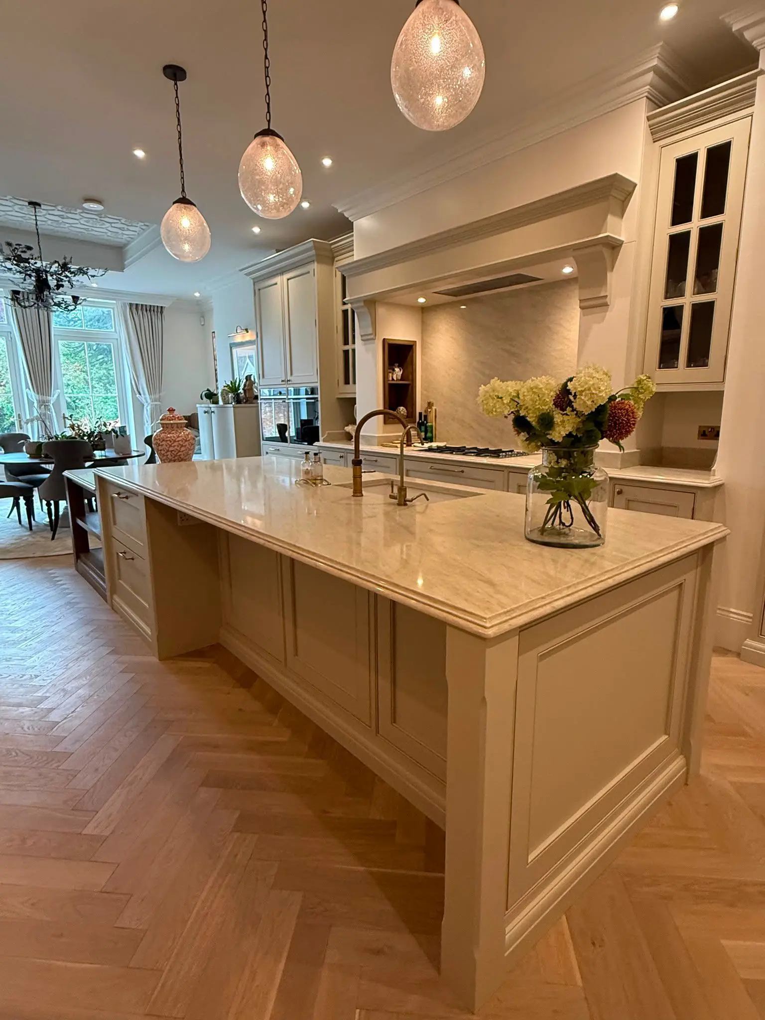 Large Taj Mahal quartz kitchen island with matching worktops