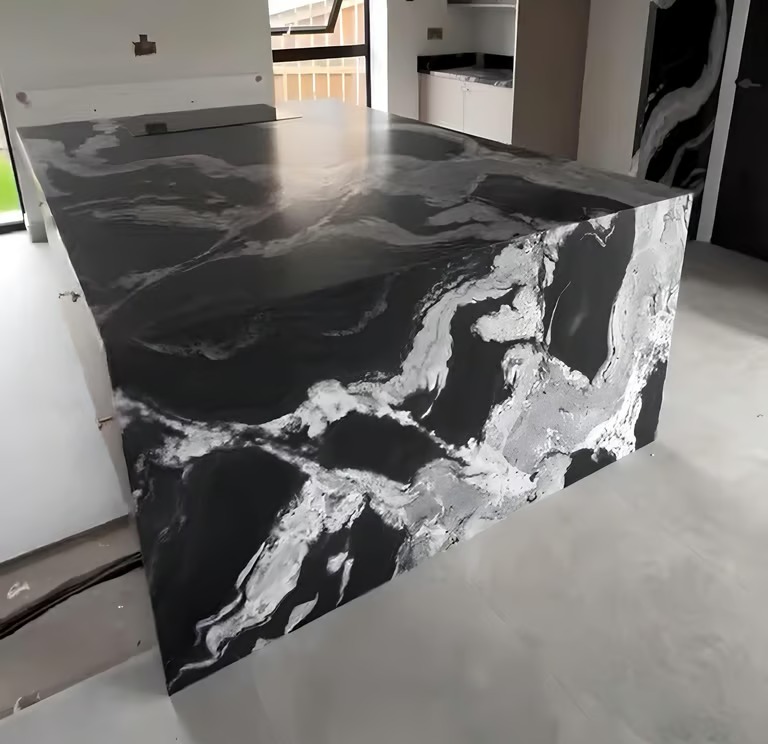 Black and white granite waterfall worktop fabricated by RH Stone Surfaces
