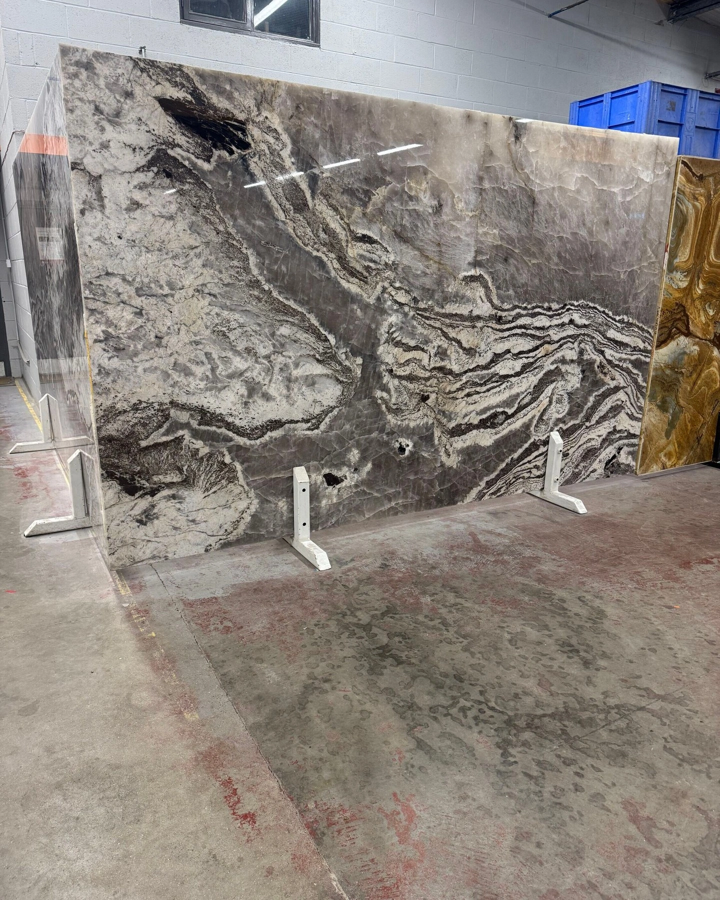 Grey natural granite slab displayed at the RH Stone Surfaces showroom