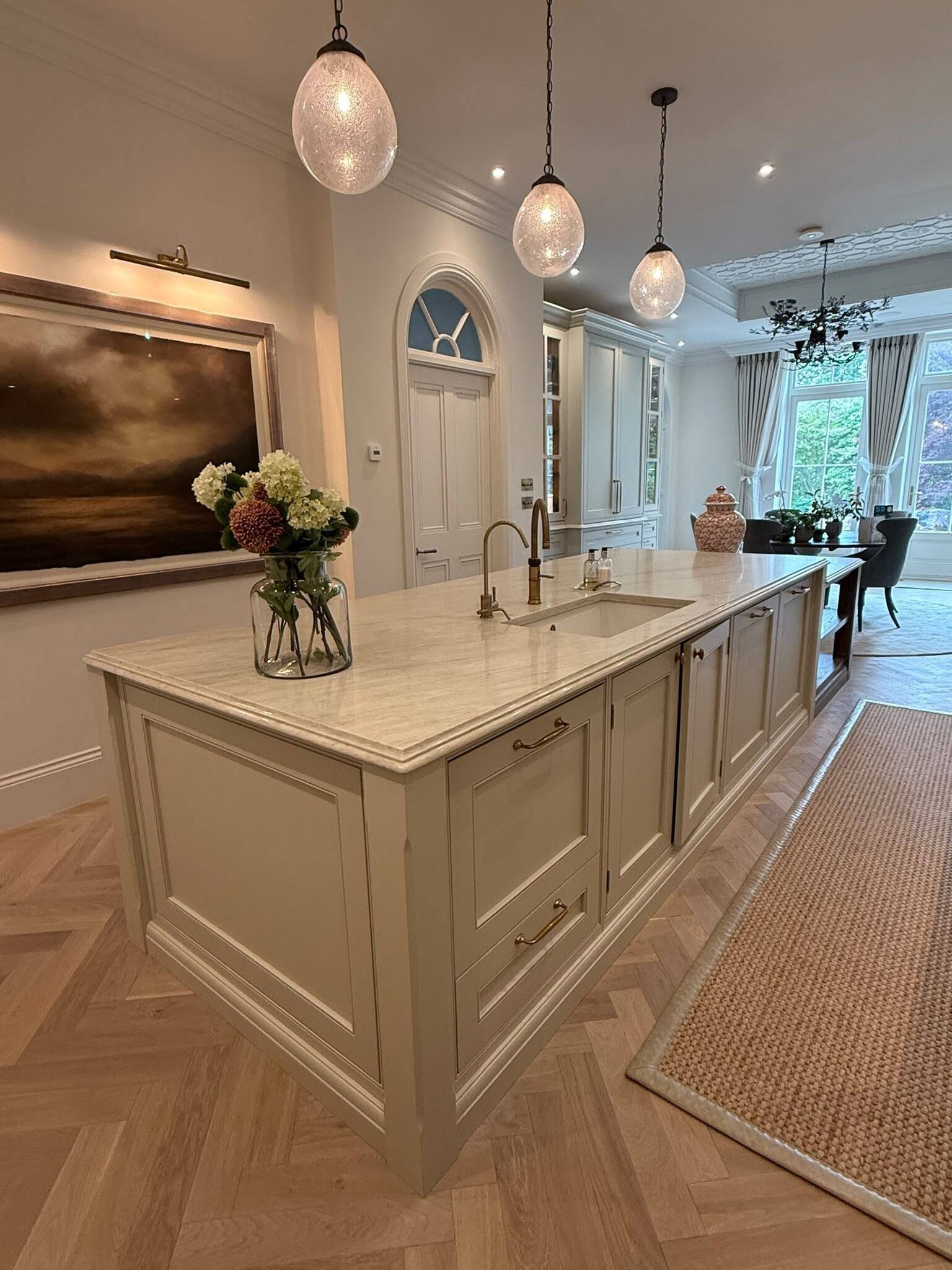 Taj Mahal quartz kitchen island by RH Stone Surfaces