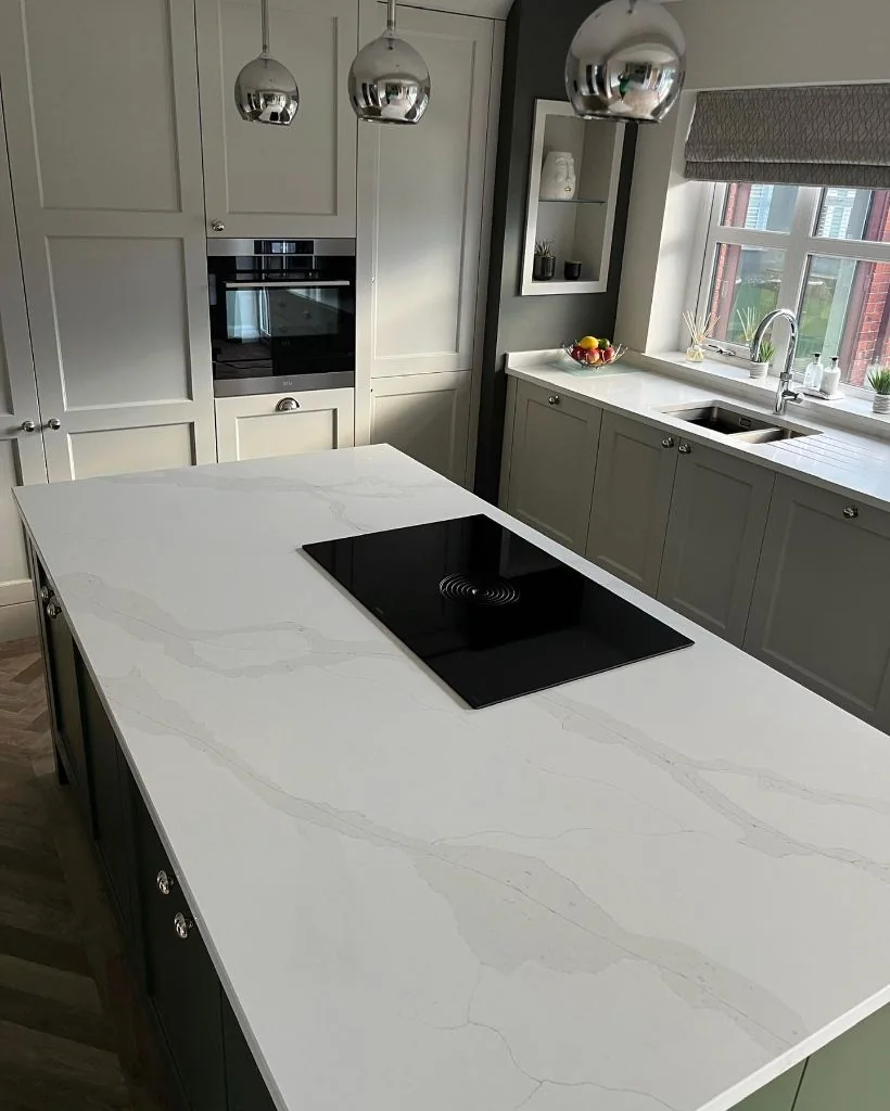 White veined quartz kitchen island supplied by RH Stone Surfaces